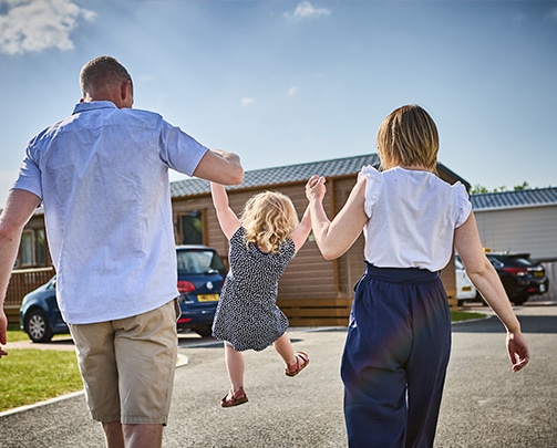 Family-outisde-caravan Family-outisde-caravan